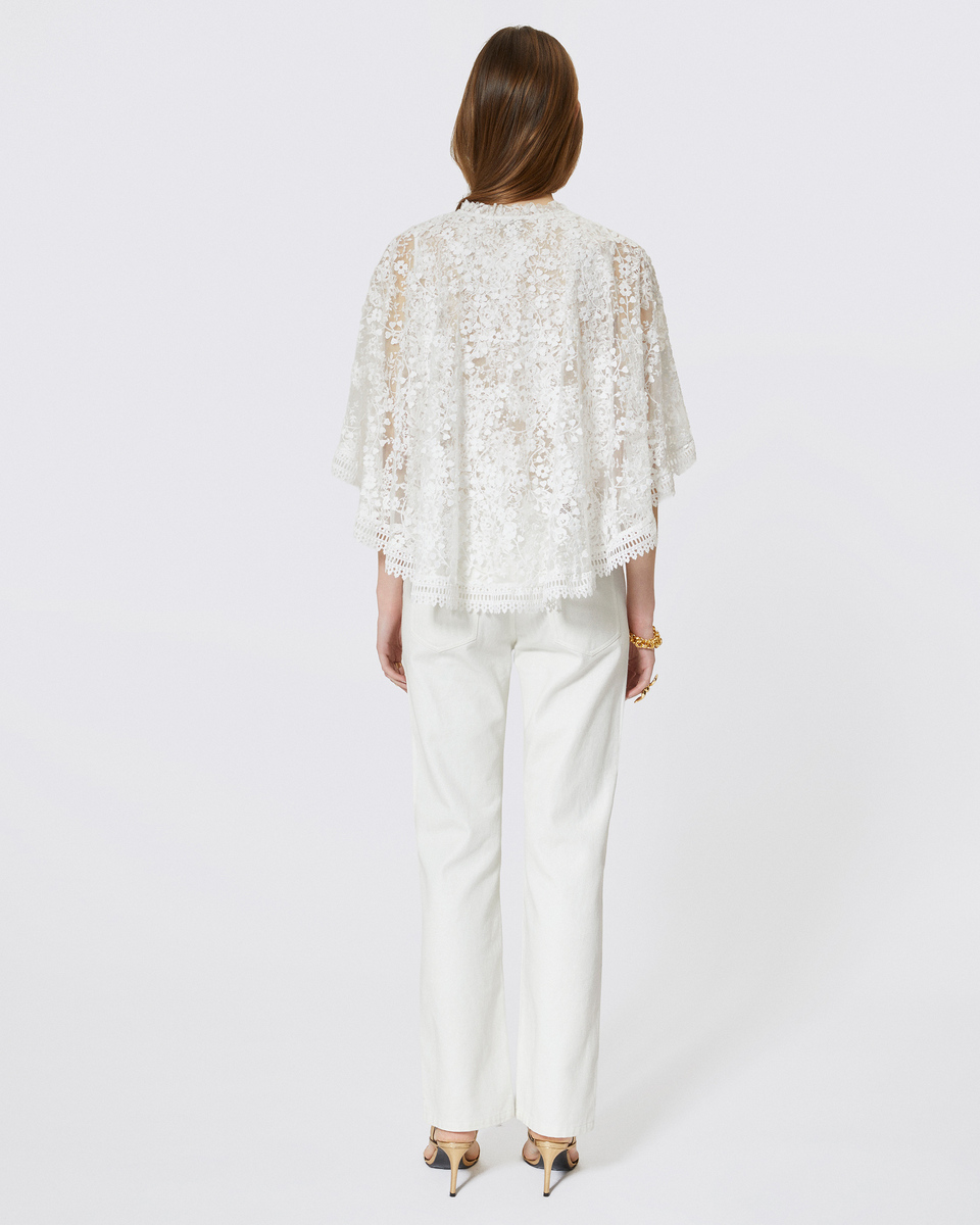 Top with ecru lace cape