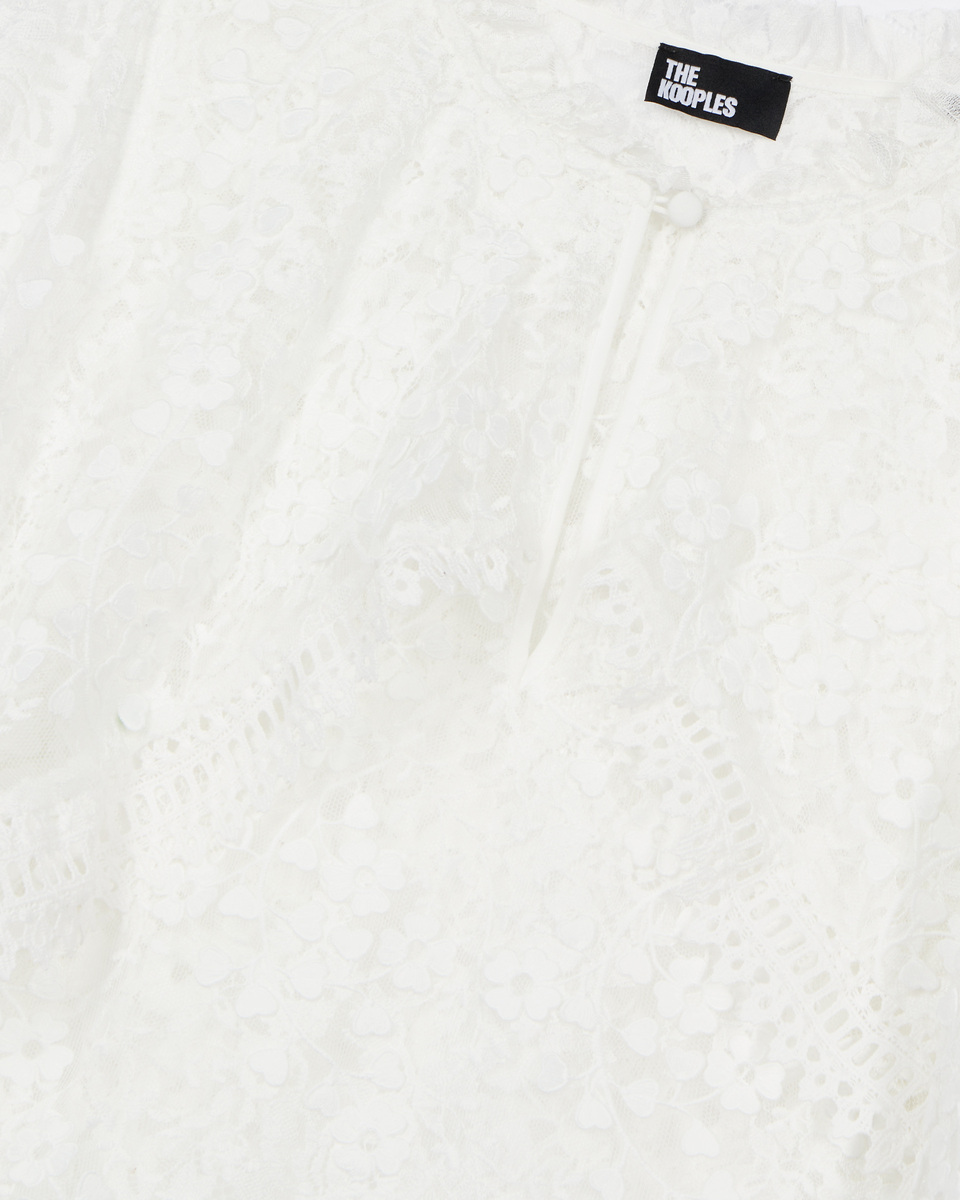 Top with ecru lace cape