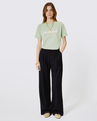 'What Is' T-shirt with green rhinestones