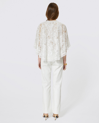 Top with ecru lace cape