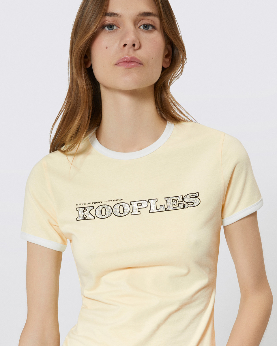 T-shirt with yellow rhinestone logo