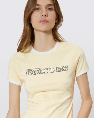 T-shirt with yellow rhinestone logo