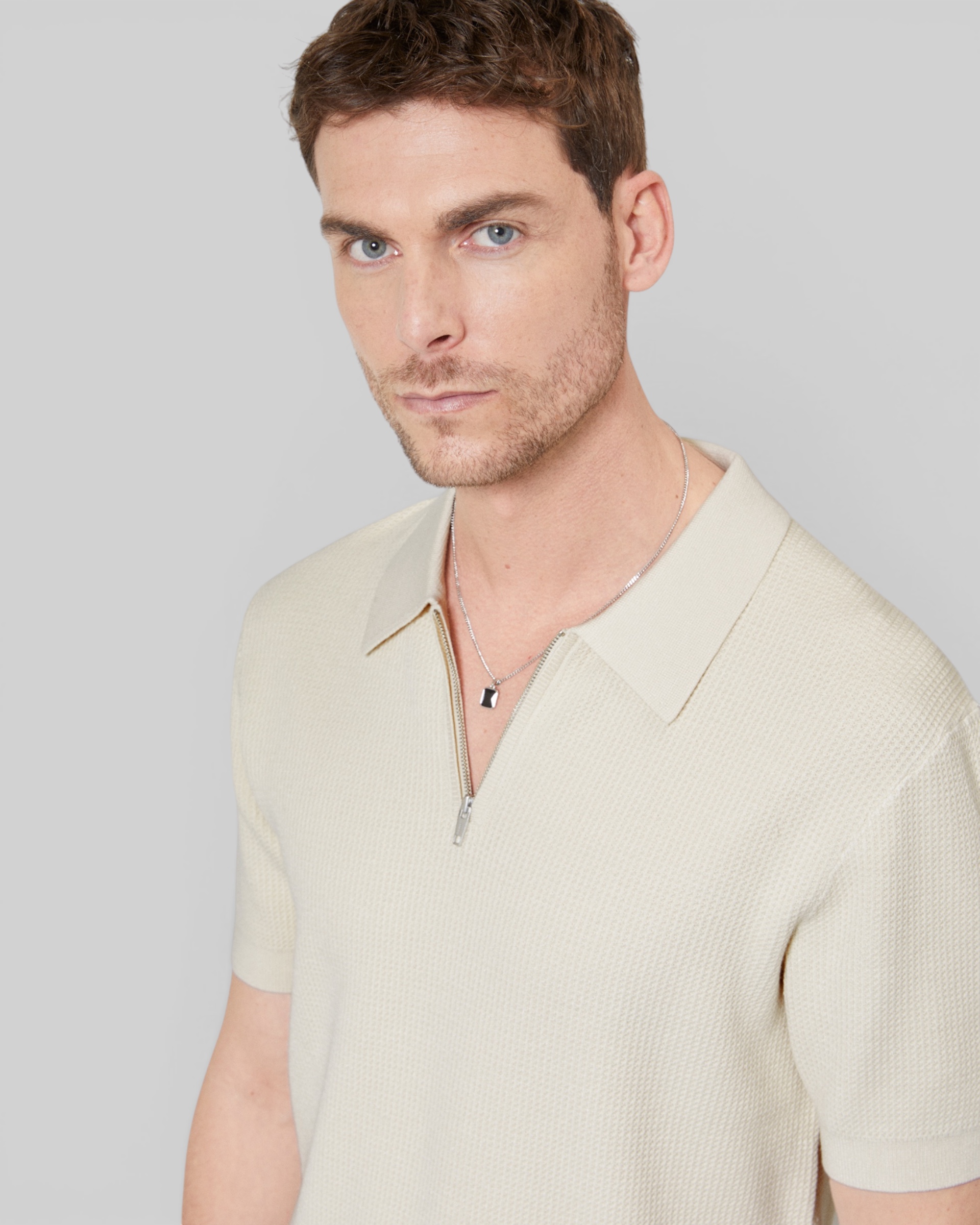 Beige polo-neck zip sweater