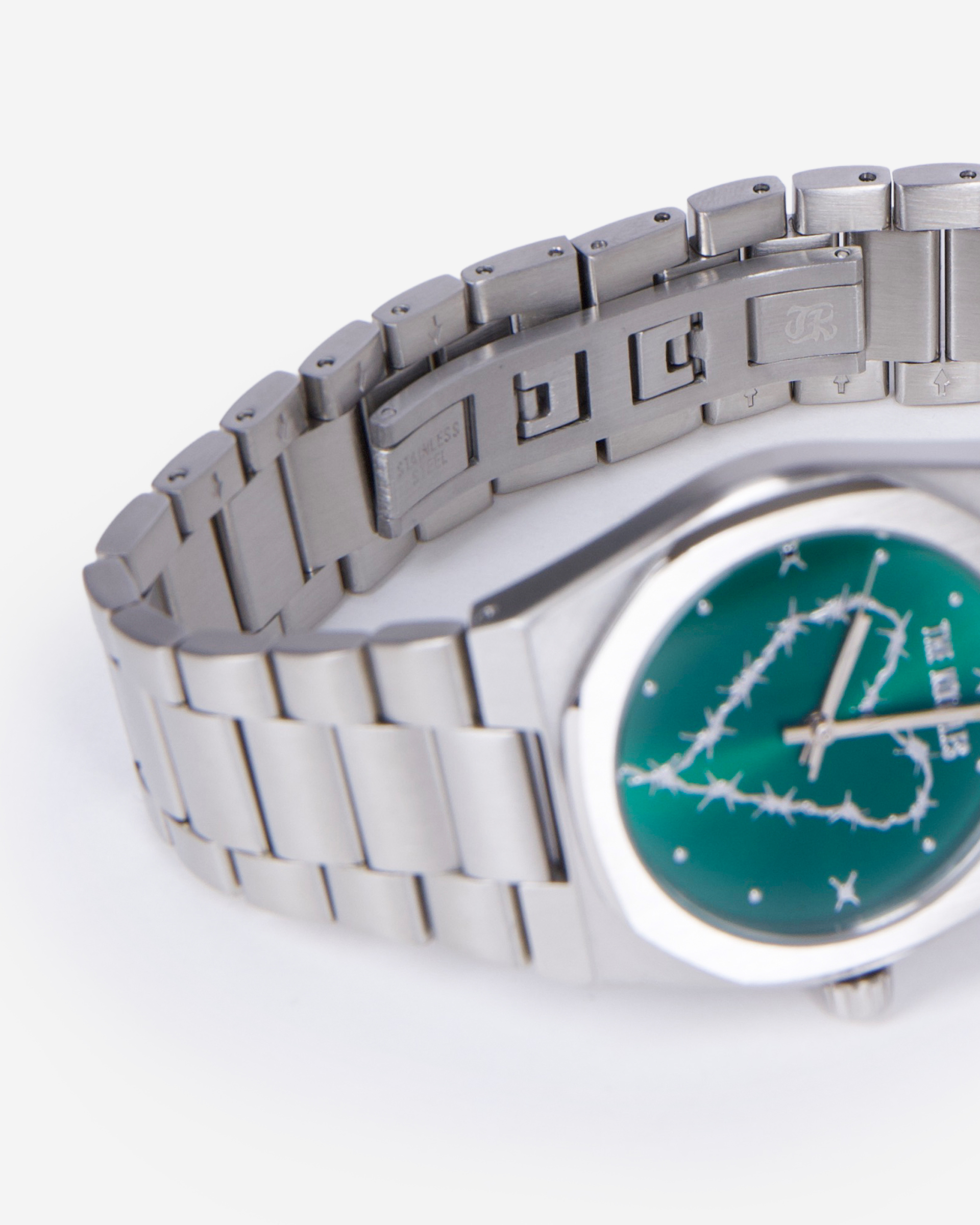 Silver heart watch with green dial
