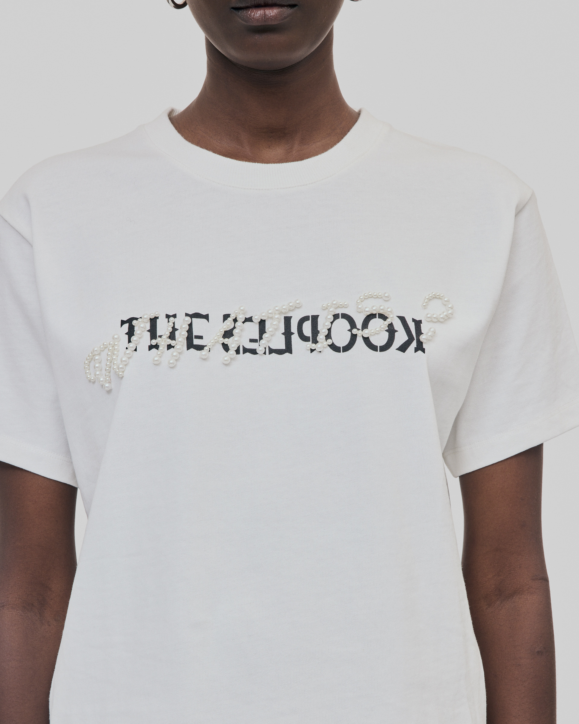 'What Is' T-shirt with white beads