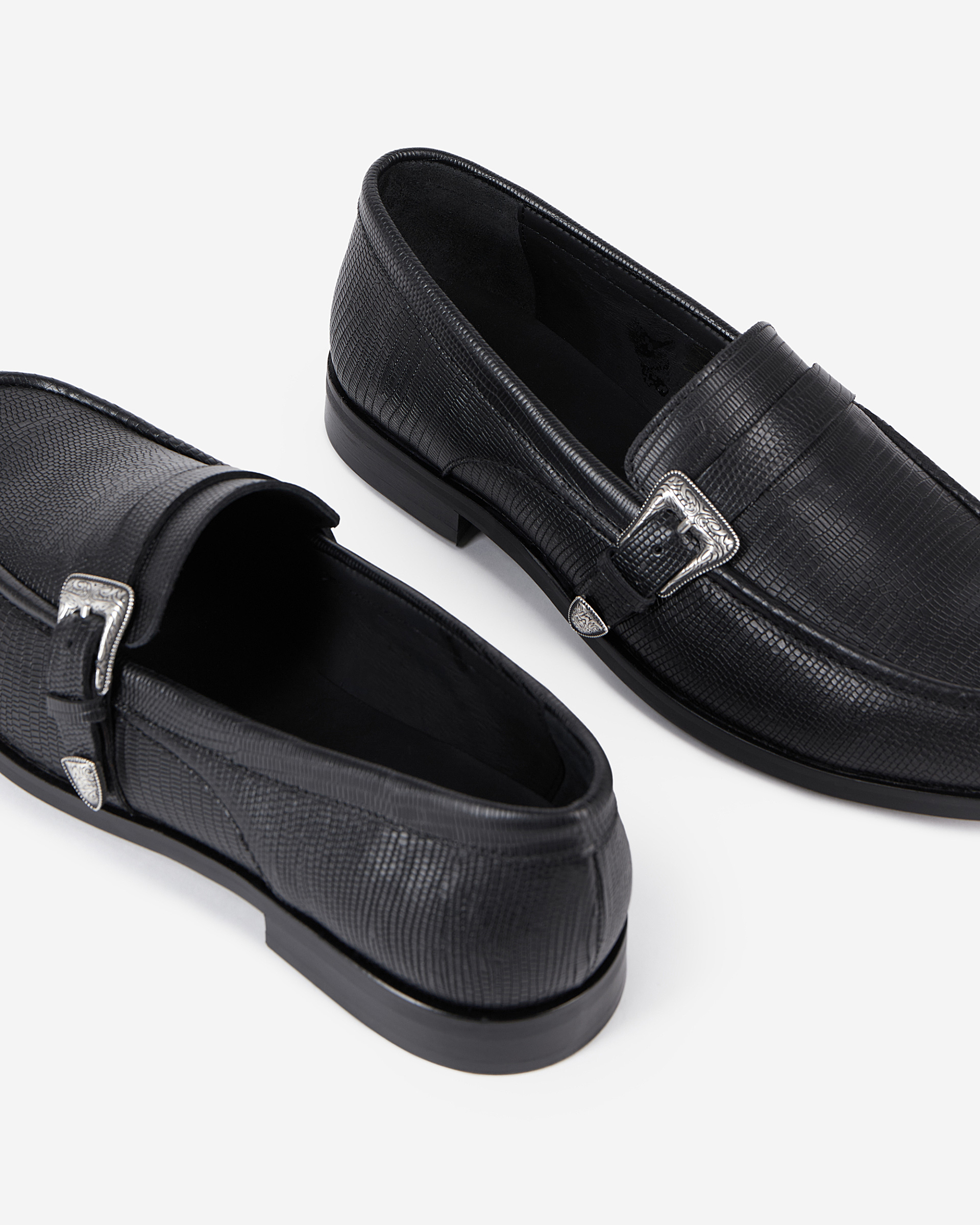 Black leather loafers with western buckle