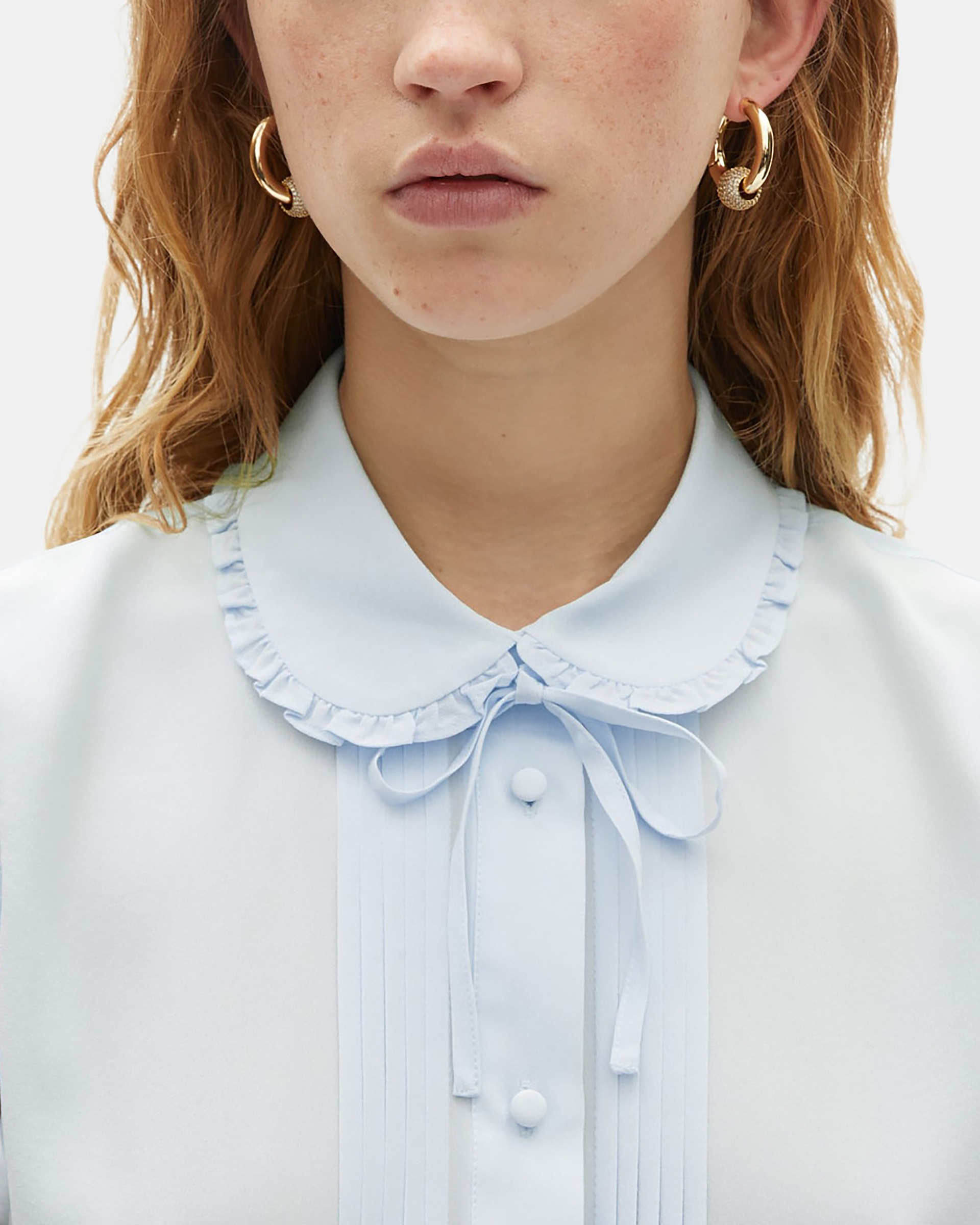 Light blue silk sleeveless shirt