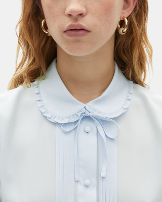Light blue silk sleeveless shirt